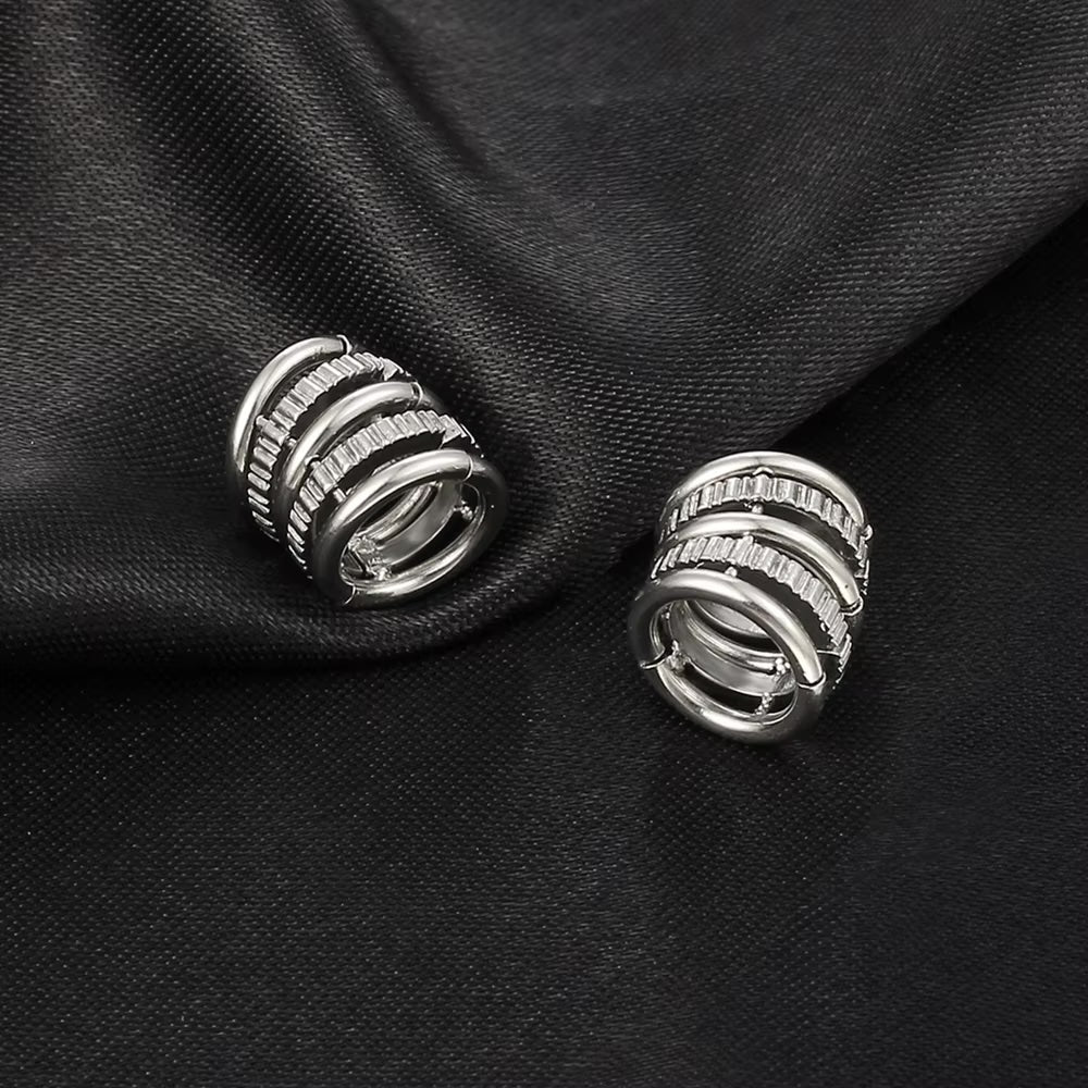 Cuff Lobe Unique Ring en acero inoxidable 316L con diseño minimalista, ideal para expansiones desde 6mm. Disponible en plateado